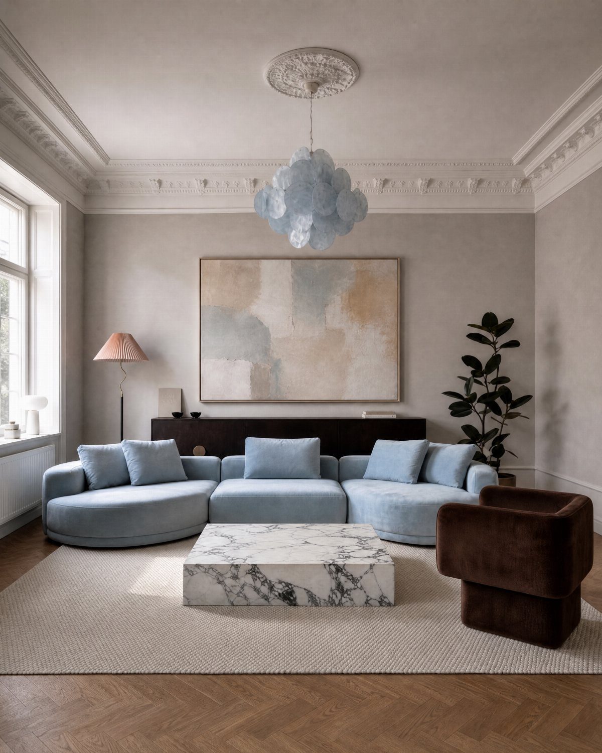 Light blue curved sectional sofa in a living room with cream and beige decor.
