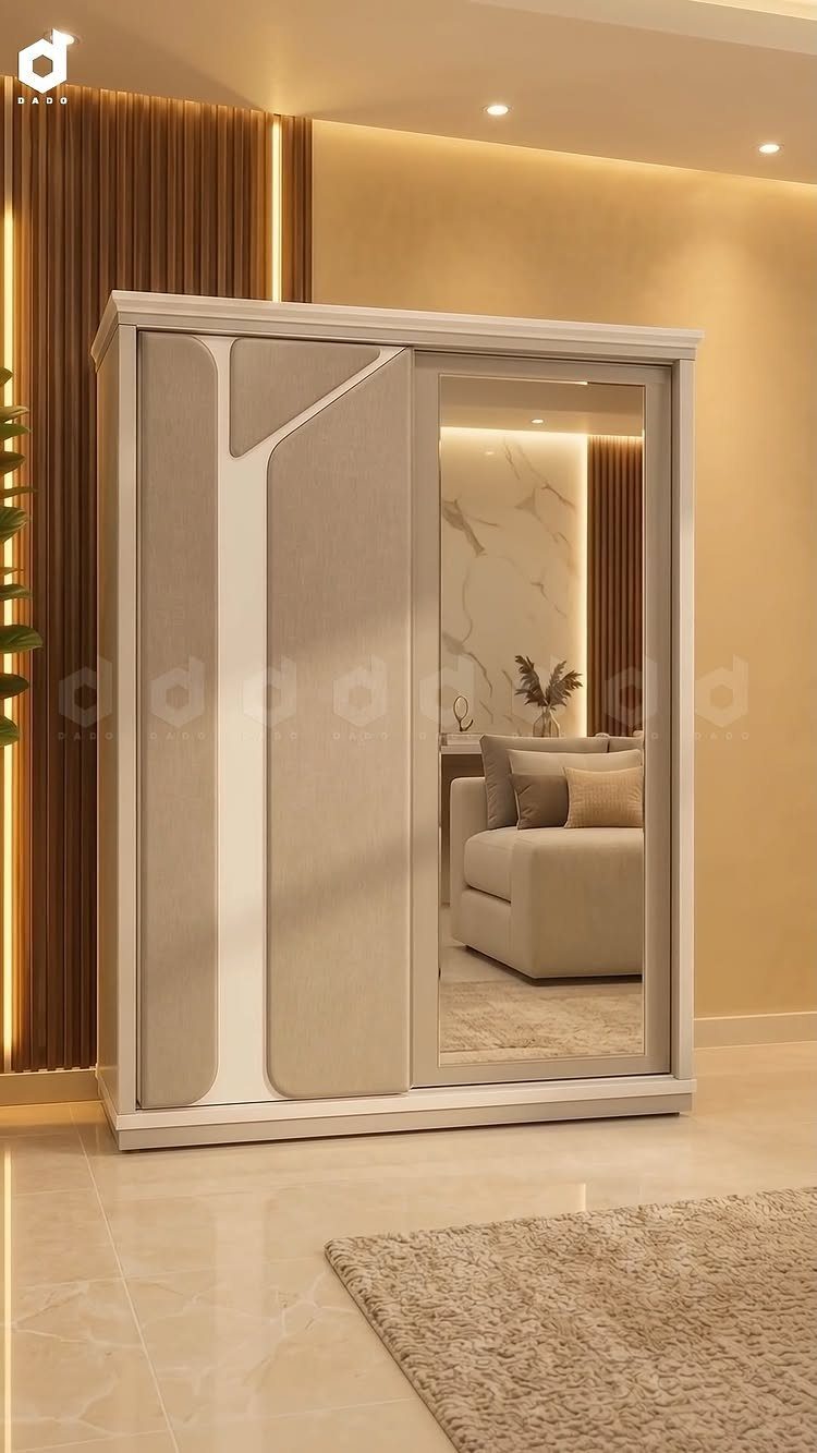 Modern white sliding wardrobe with a full-length mirror reflecting a cozy living room area.