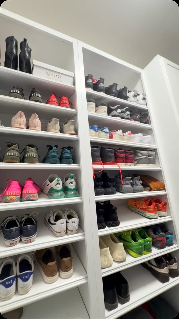 White closet shelves displaying a variety of colorful sneakers and shoes.