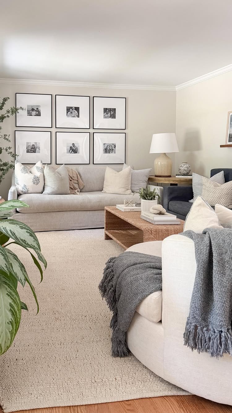 Tan woven jute rug in a bright coastal living room with neutral furniture.