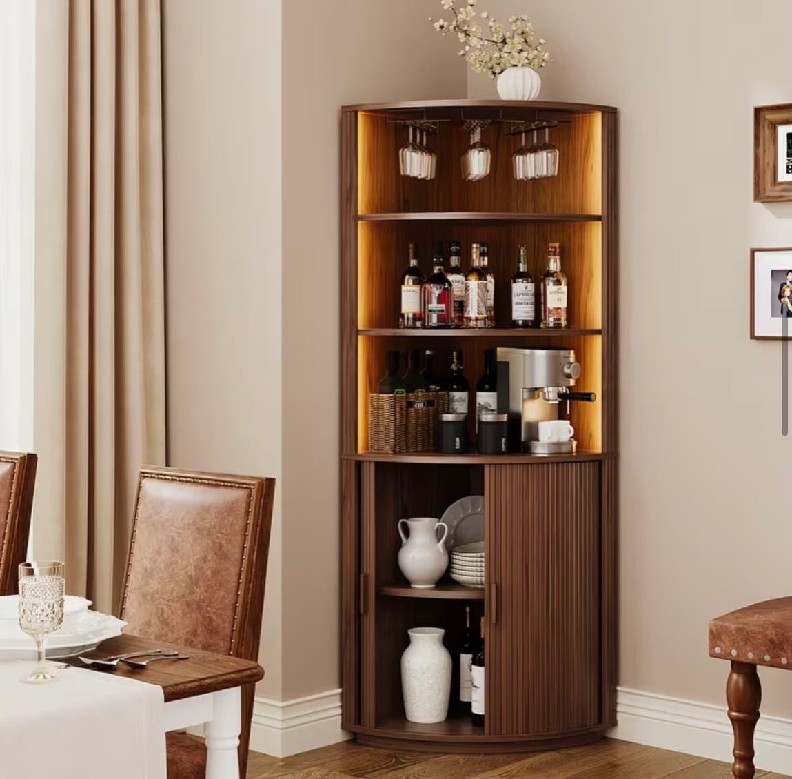 Curved wooden corner wine bar shelf with integrated lighting and liquor bottles.