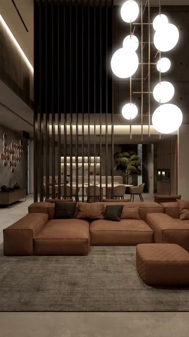 Brown modular leather sofa and spherical pendant lights in a modern living room