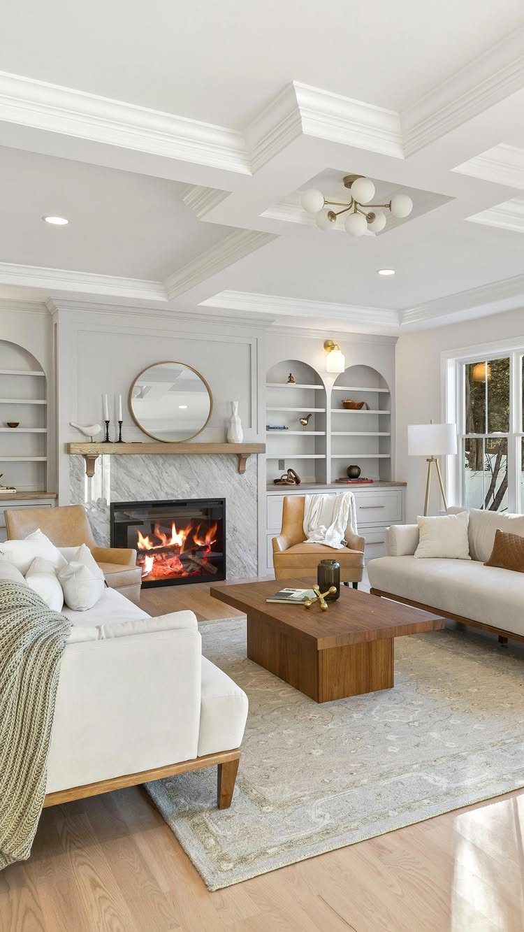 White coffered ceiling with grid pattern and globe chandelier in a bright living room.