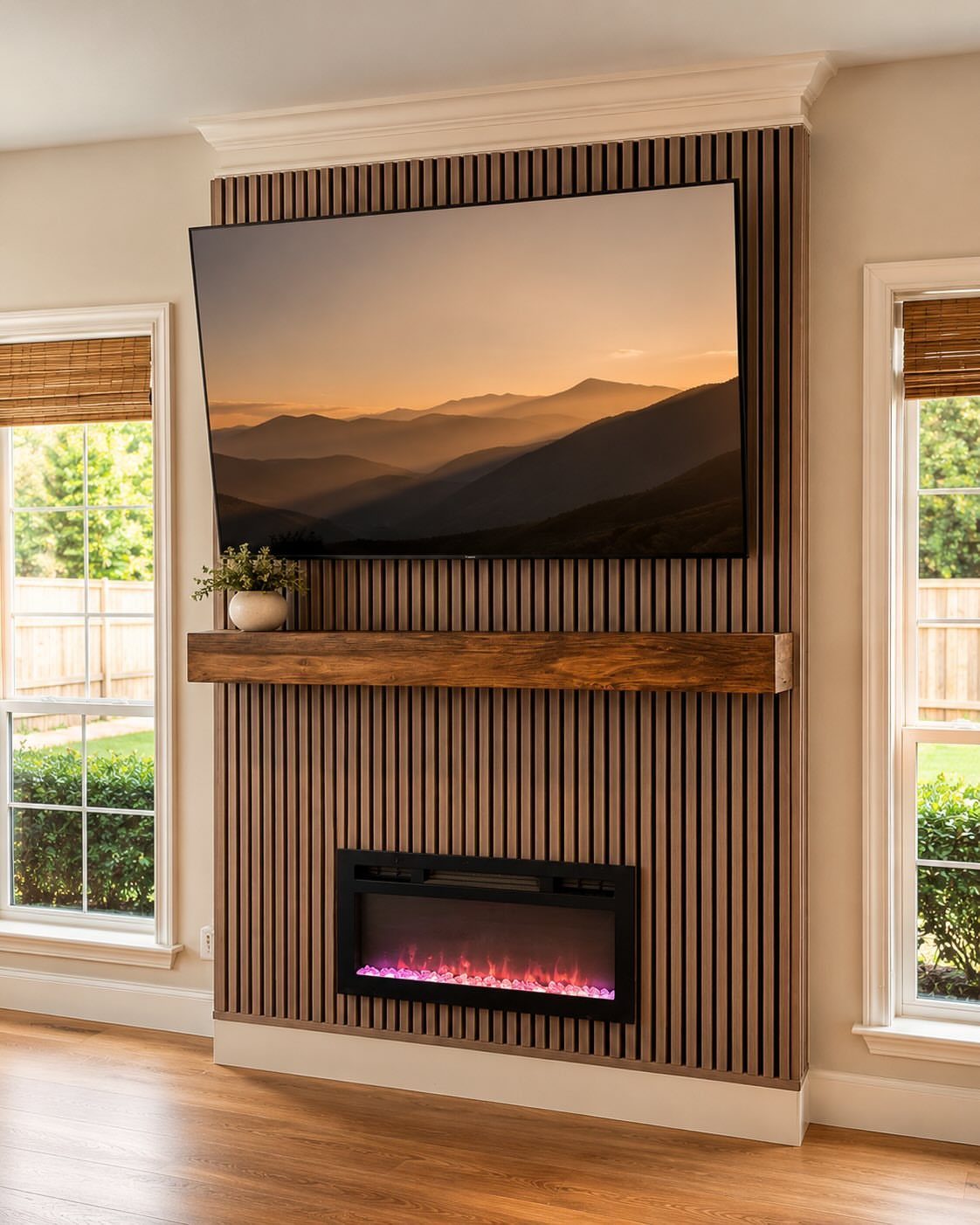 Modern living room with a wooden floating mantel above a linear electric fireplace.