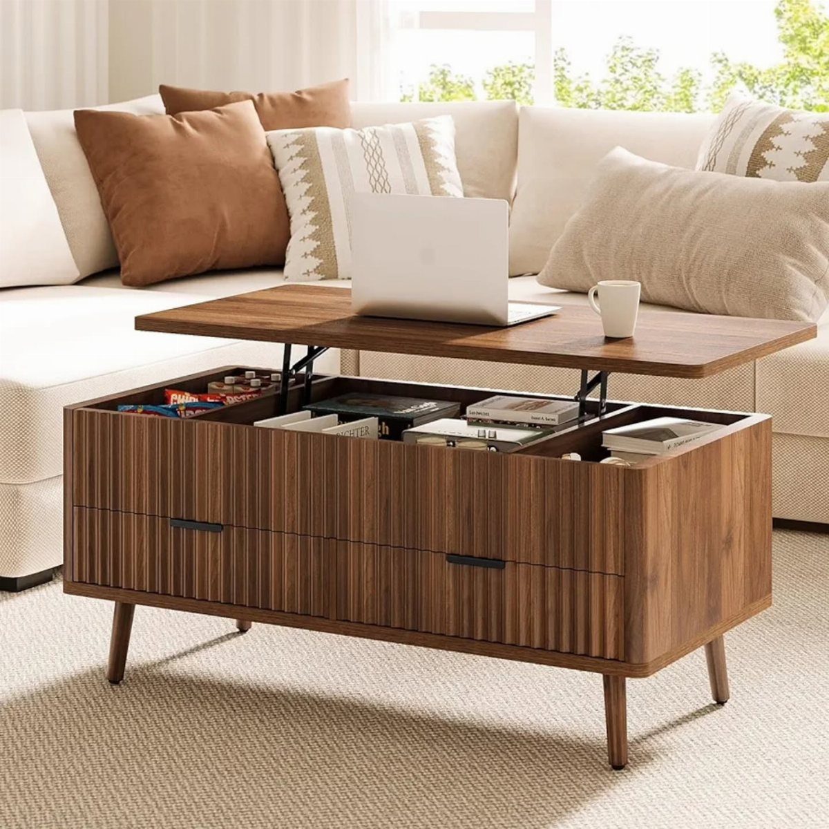 Wooden lift-top coffee table with storage compartment containing books and games.