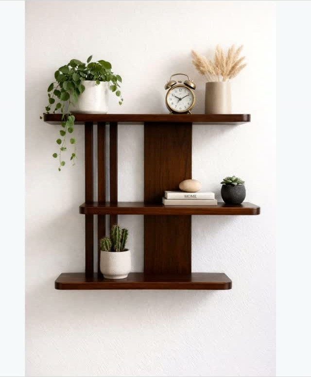 Dark brown wooden wall-mounted shelves holding plants, a clock, and decorative items.