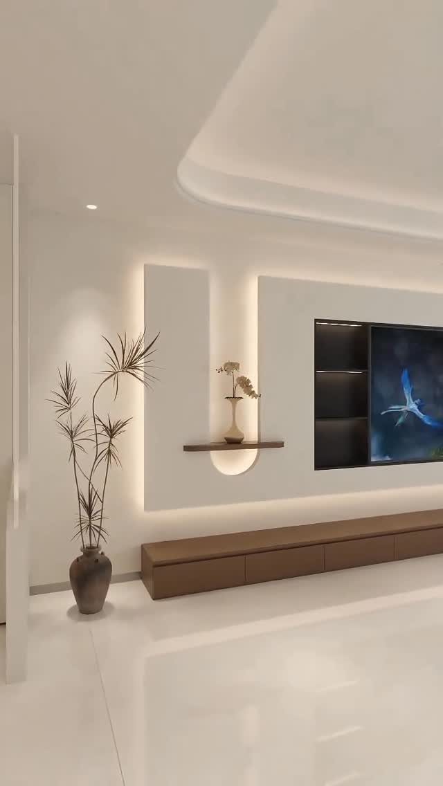 Modern living room with integrated cove lighting, backlit wall panels, and minimalist furniture.