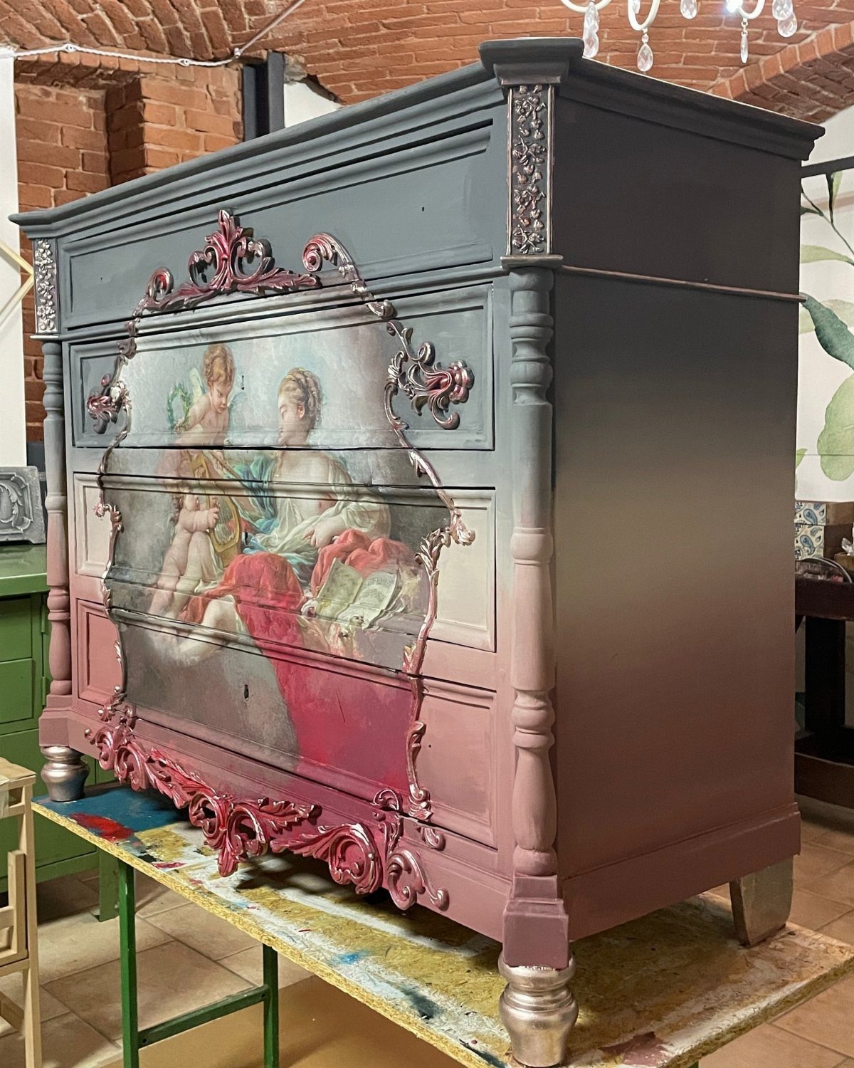 Vintage dresser with classical painting decoupage on drawer fronts and pink ombre sides.
