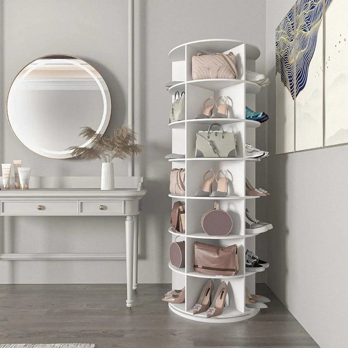 White curved shoe storage tower with cubbies holding heels and handbags in a room.